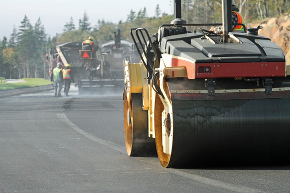 Steamroller paving a roadway.