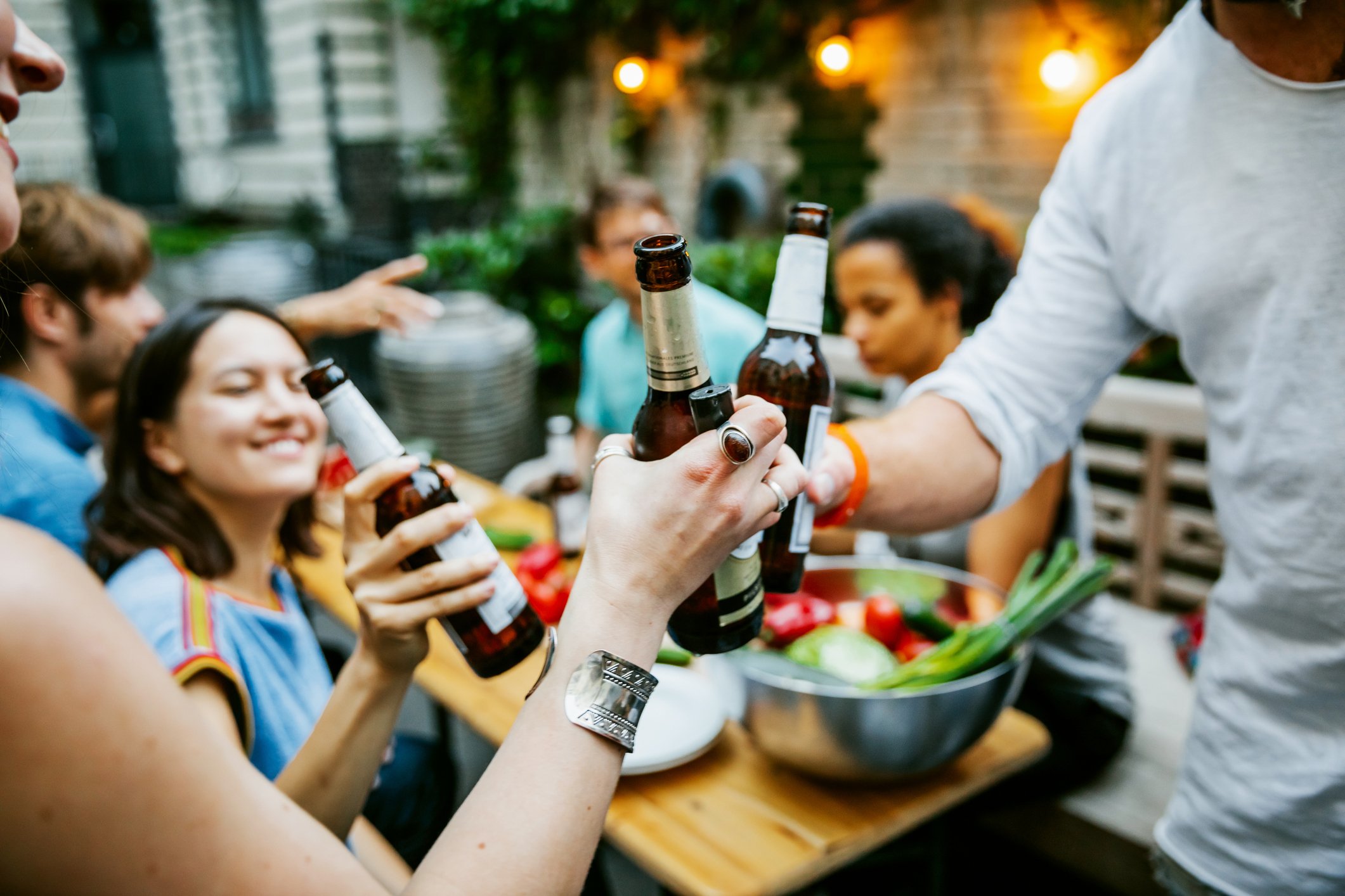People drinking together outside.