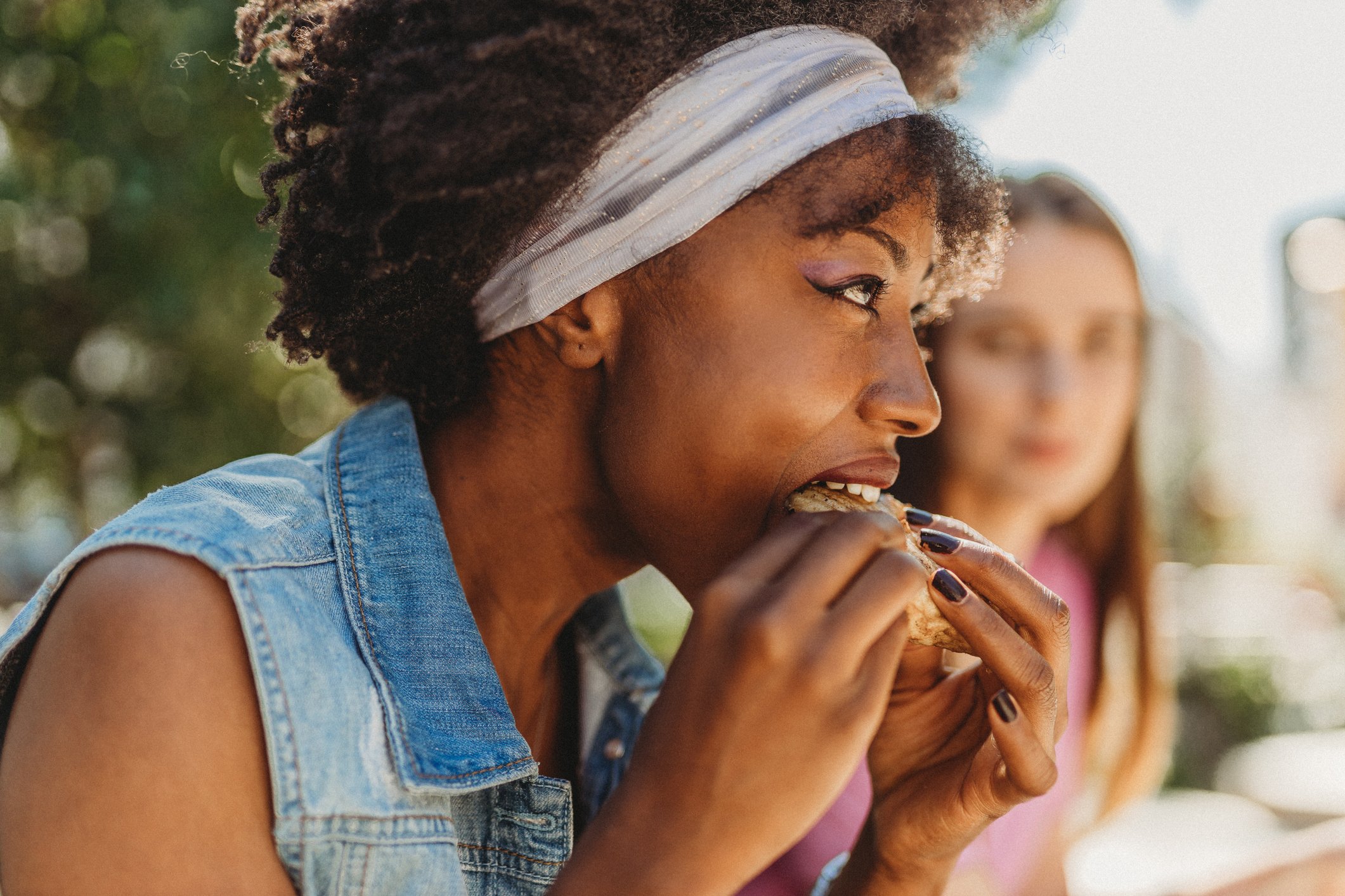 Person eating a burger.
