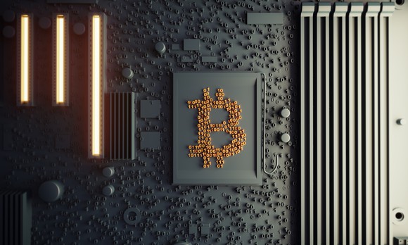 Representation of a Bitcoin on a computer chip. 