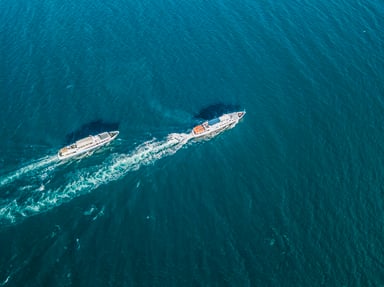 2 cruise ships racing with one in the lead