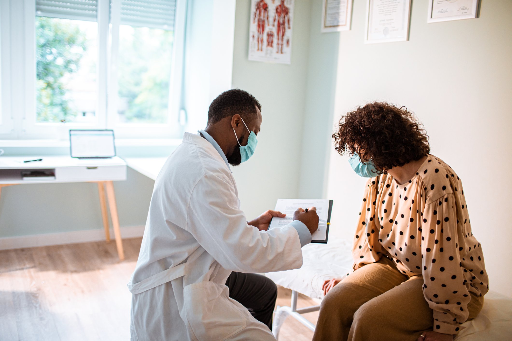 A doctor conducts a medical exam on a patient.