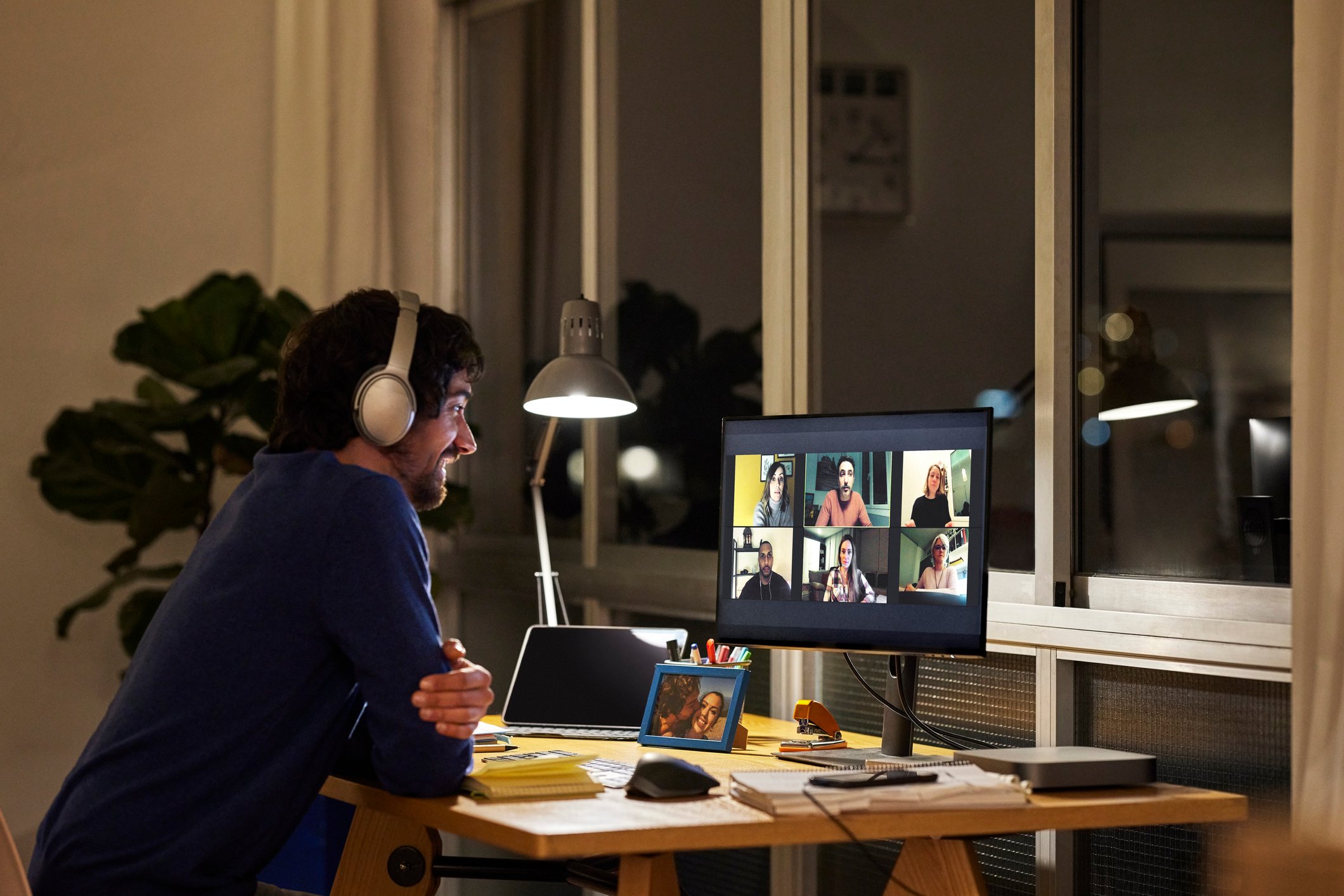 Man wearing headphones on a video conference.