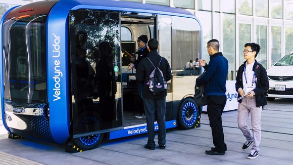 passenger shuttle using velodyne lidar technology with people boarding.