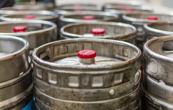 Beer kegs lined up. 