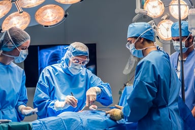 A surgical team works in the operating room