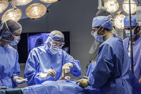 A surgical team works in the operating room.