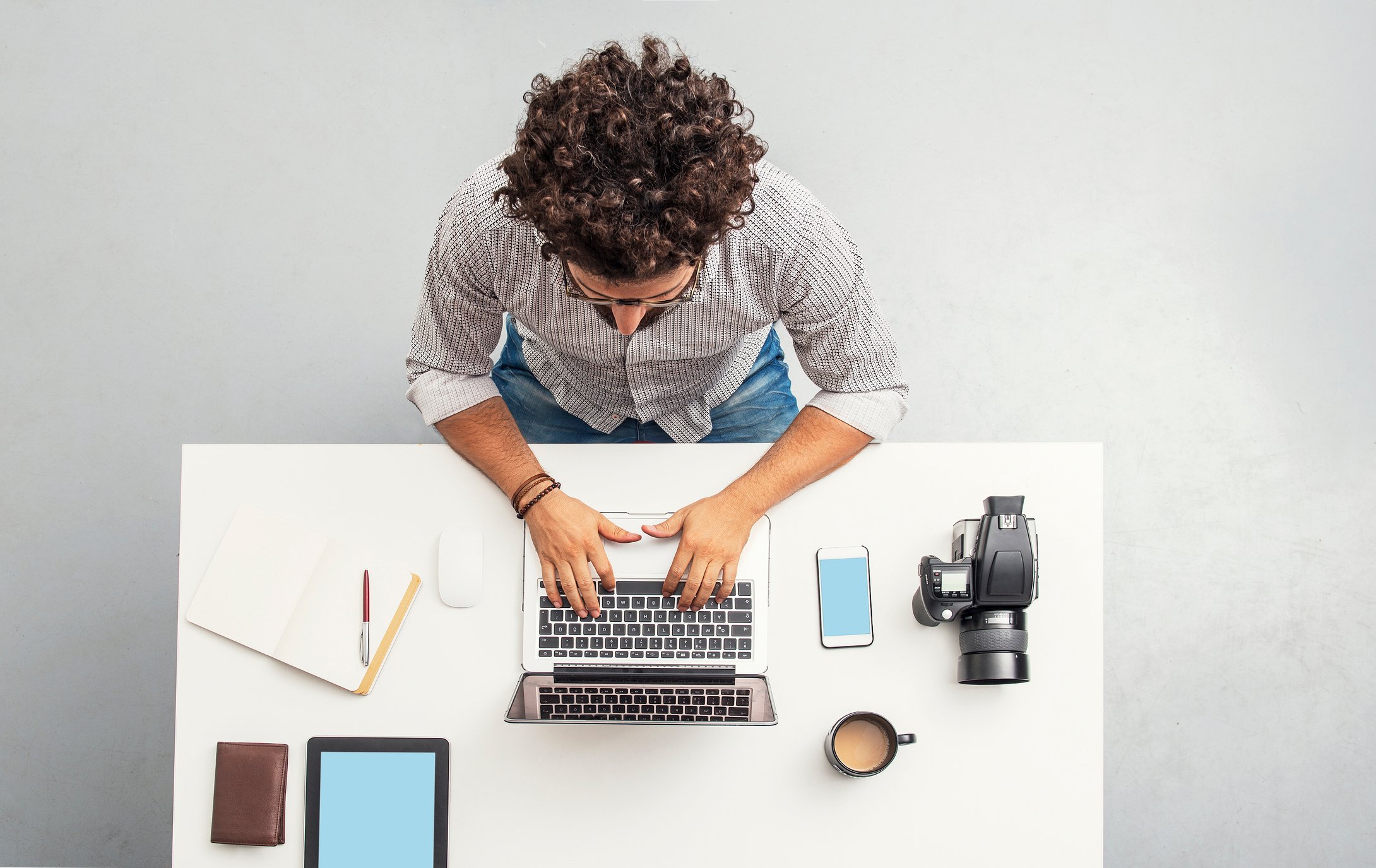 Person working from a table at home. 