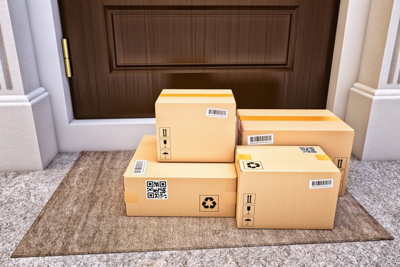 Several boxes on a doorstep.