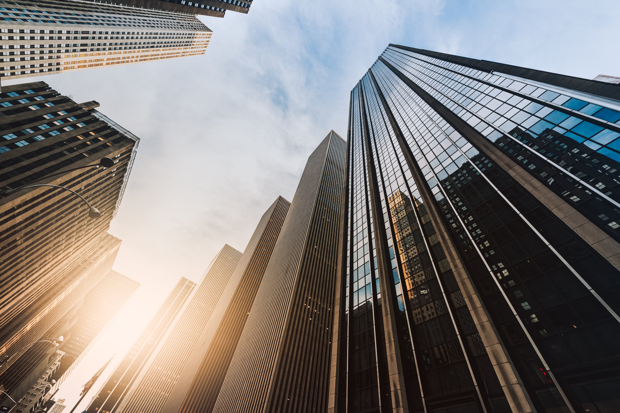 The view from the ground up the side of high-rise buildings made with steel.