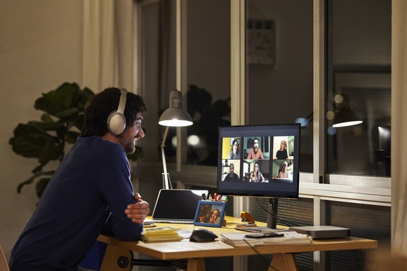 Person wearing headphones on a video call.