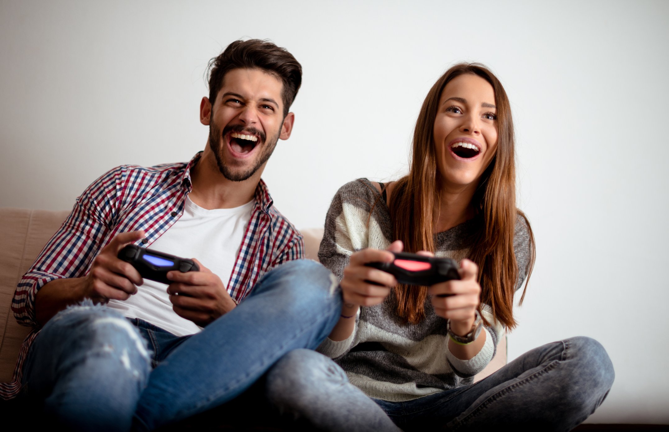Two people play a video game.