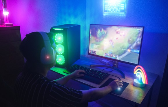 A gamer playing a video game on a PC.
