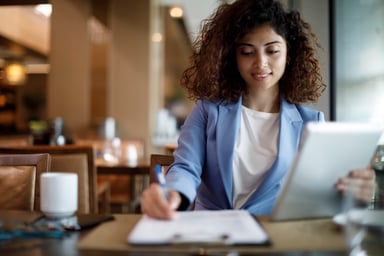 GettyImages-woman works at a cafe using tablet