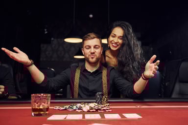 couple happily makes a wager at a casino