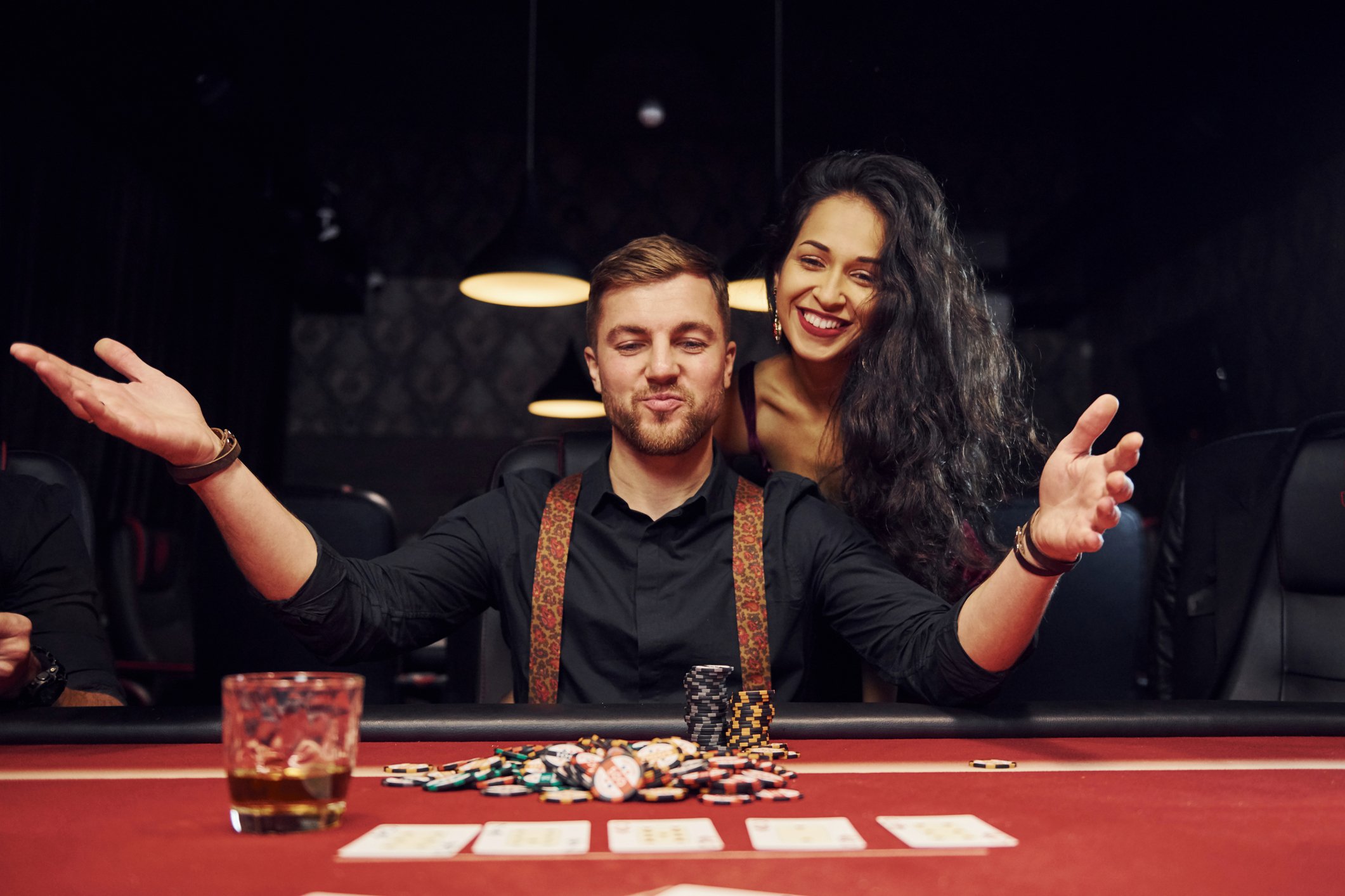 couple happily makes a wager at a casino