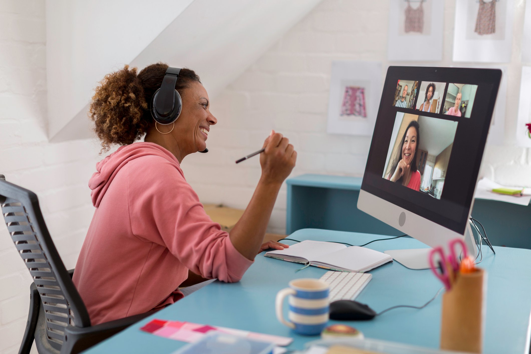 Individual at home on video conference with others.