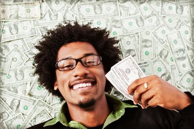 Getty - happy person with cash money