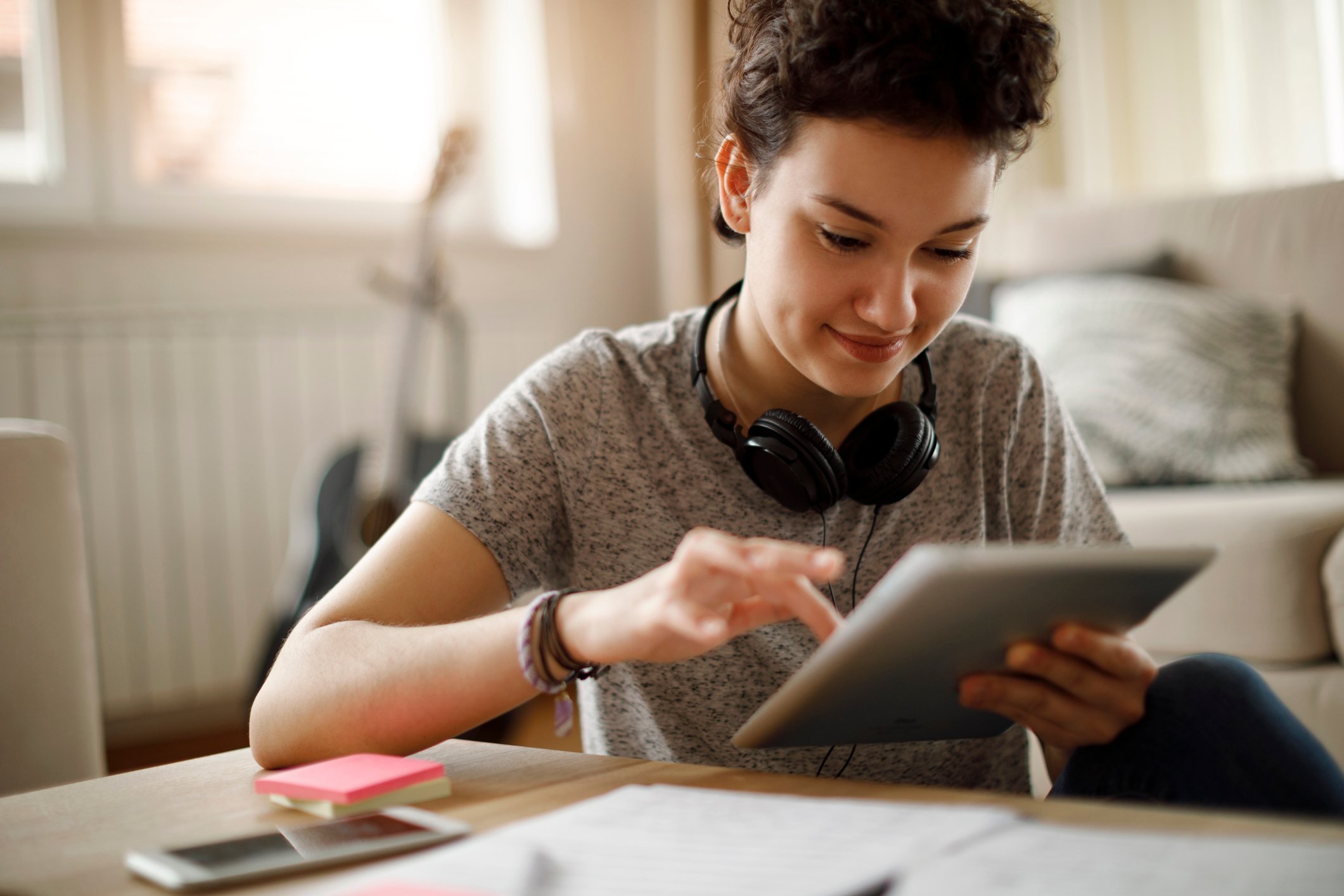 A person interacting with a tablet computer.