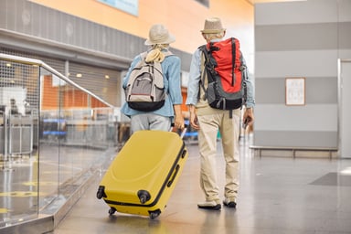 Two People Traveling in Airport