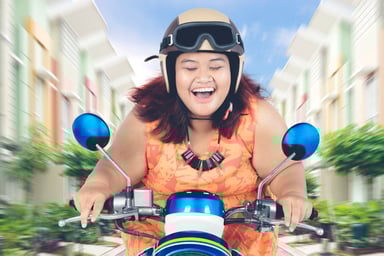 Getty - happy on scooter fast speed overdrive