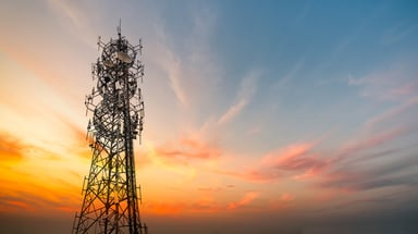 A 5G cell tower during a sunset