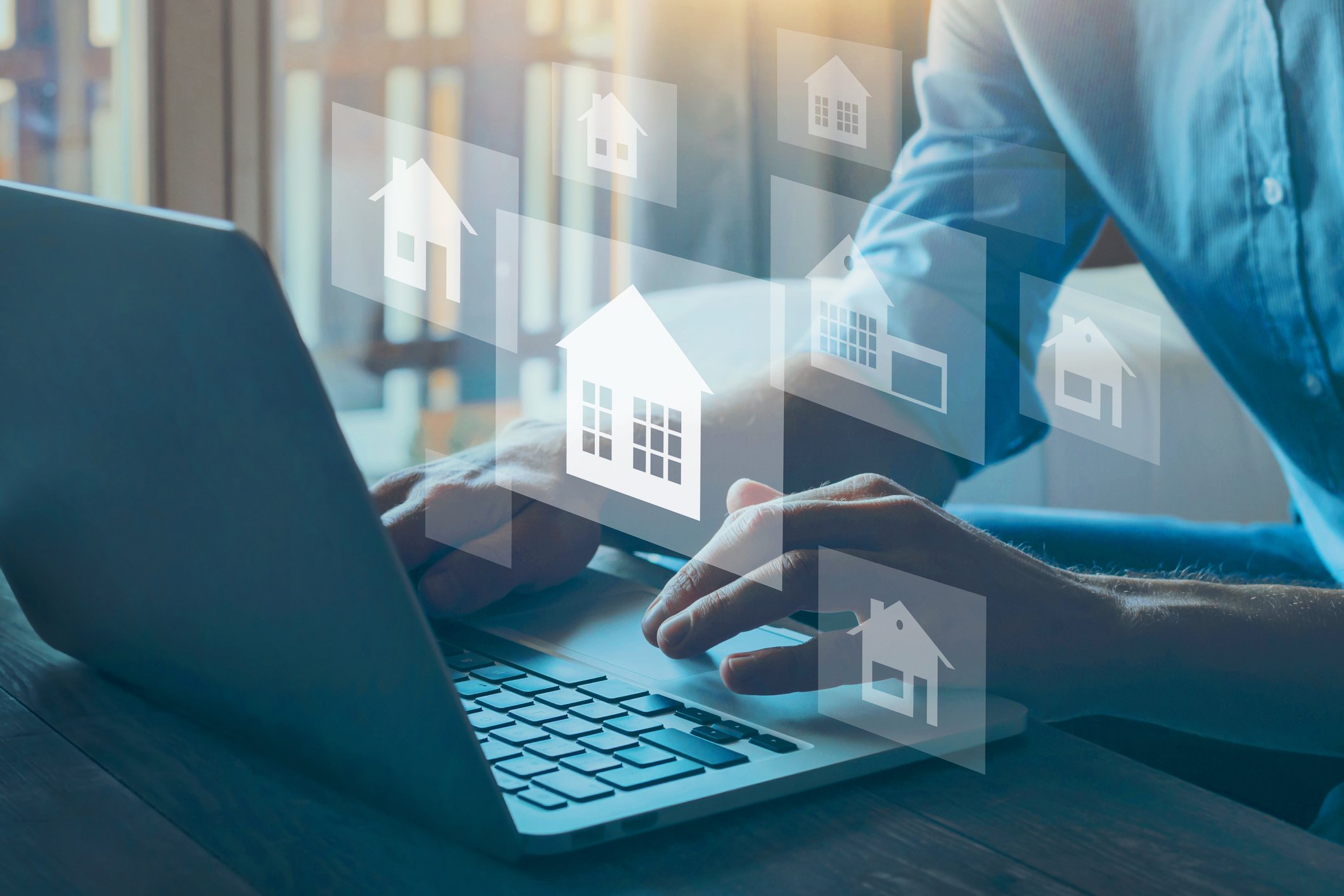 Person searching for homes online. 
