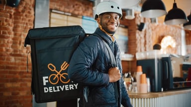 Person Delivering Food From Backpack