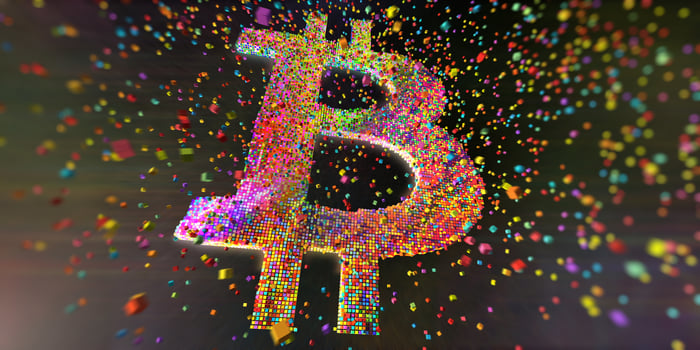 Bitcoin symbol made up of colored spheres.