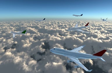 Lots of airplanes flying over a bank of clouds