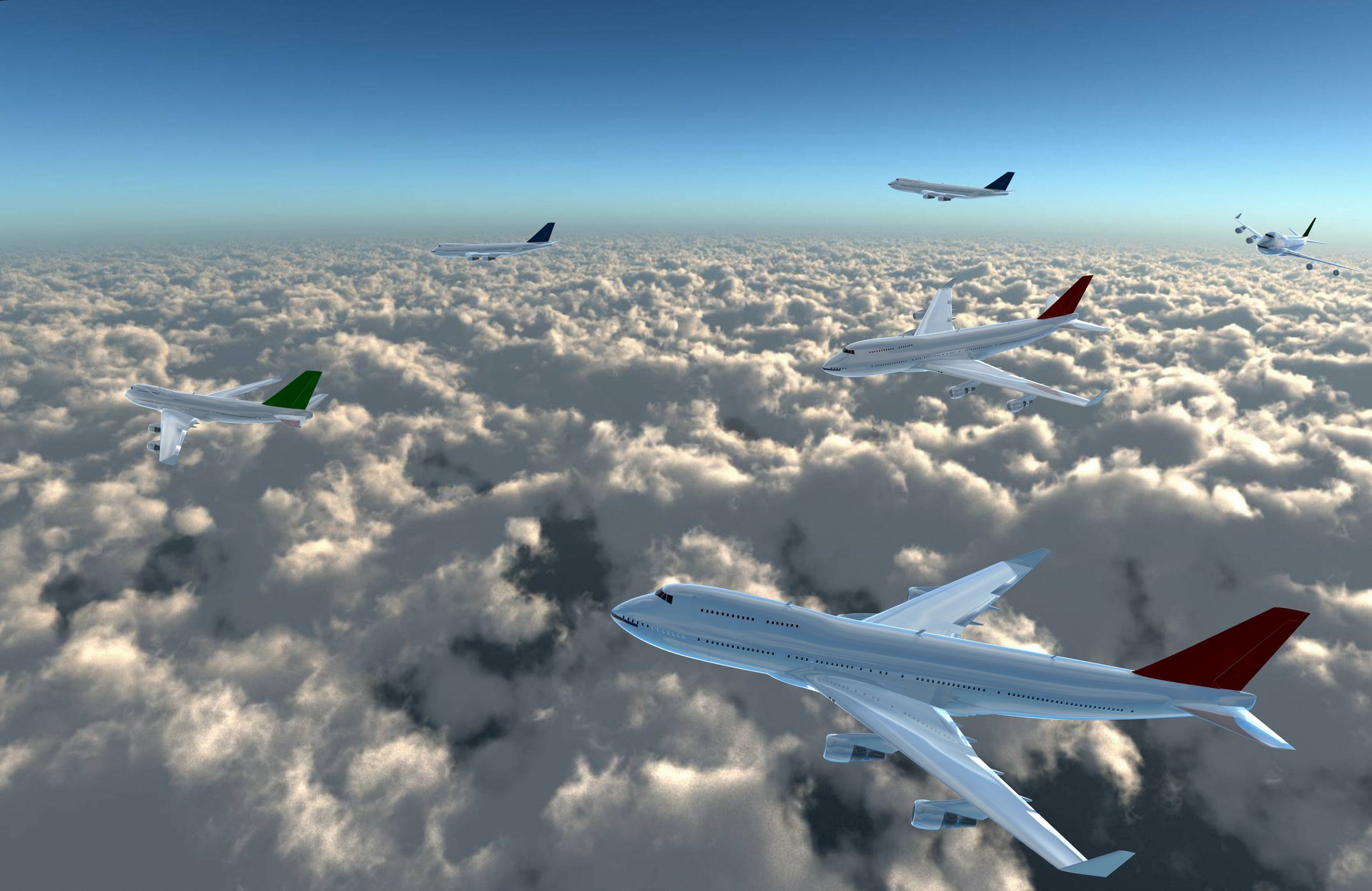 Airplanes depicted flying over a bank of clouds