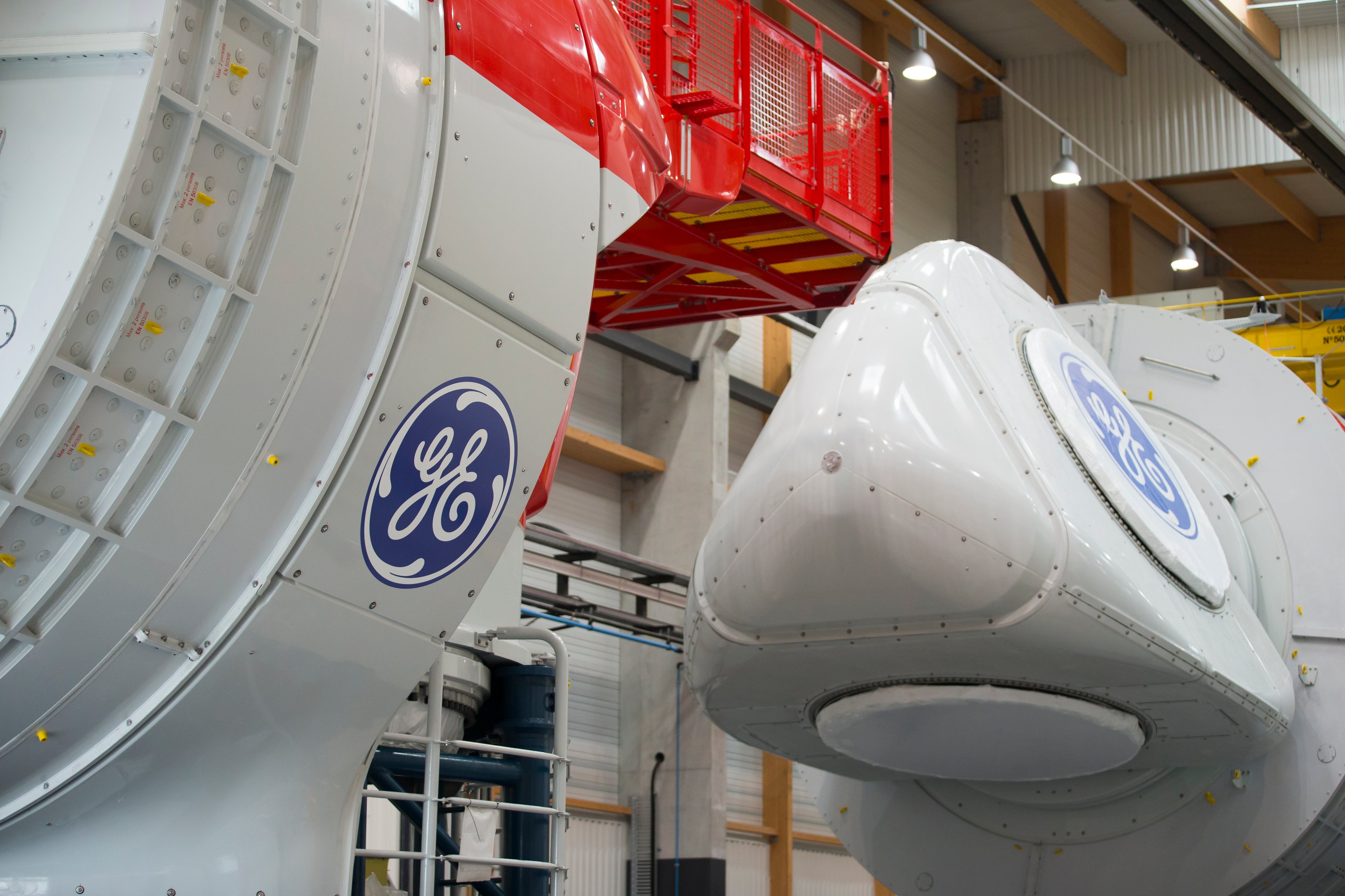 A GE turbine is shown being assembled at a plant.