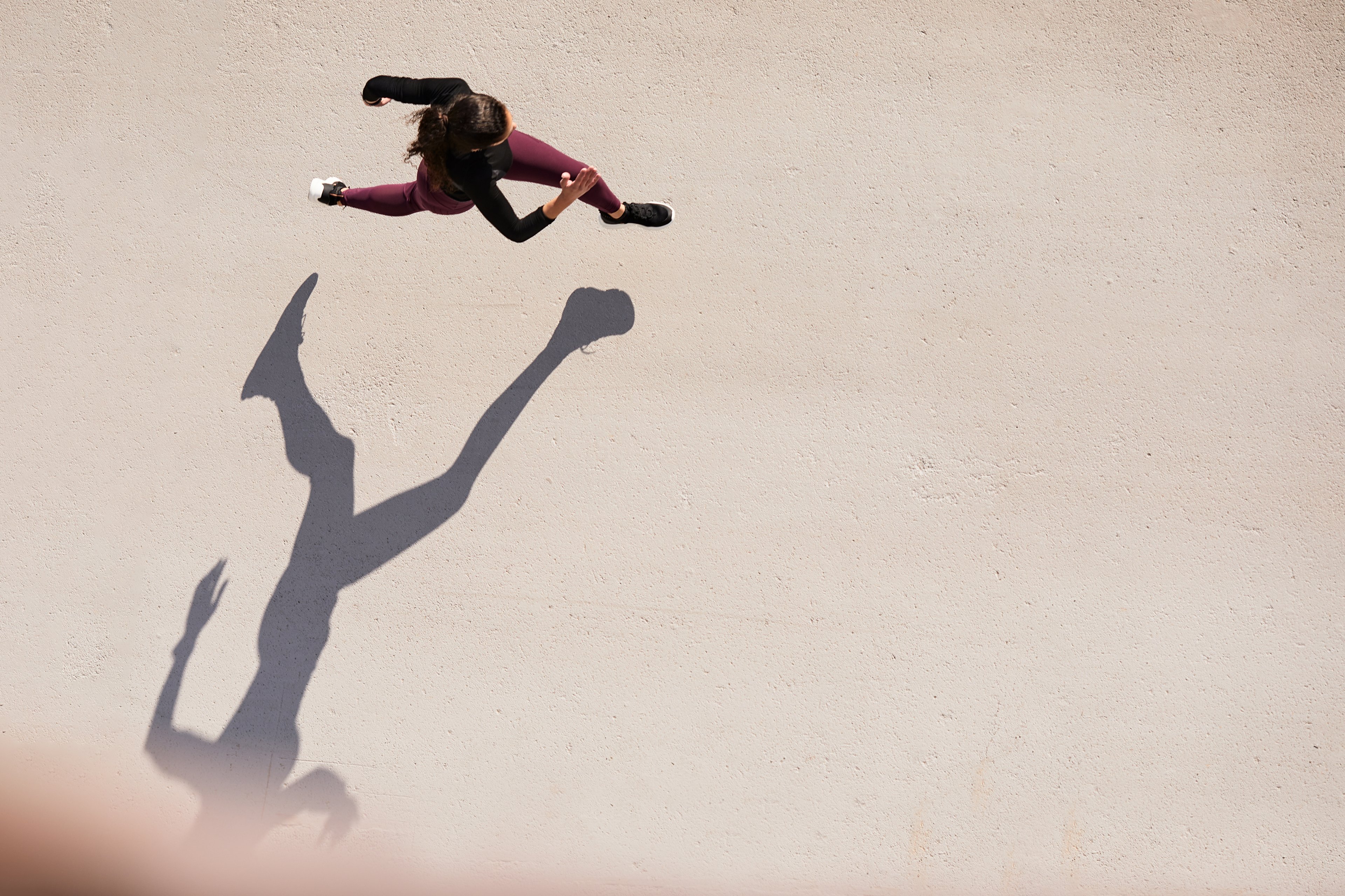 An aerial view of someone running.