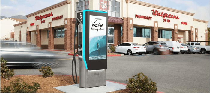 Volta charging with digital display in front of Walgreens.