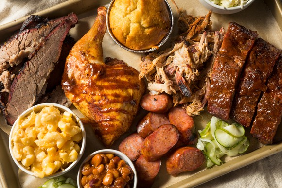 Barbecue food items on a tray.