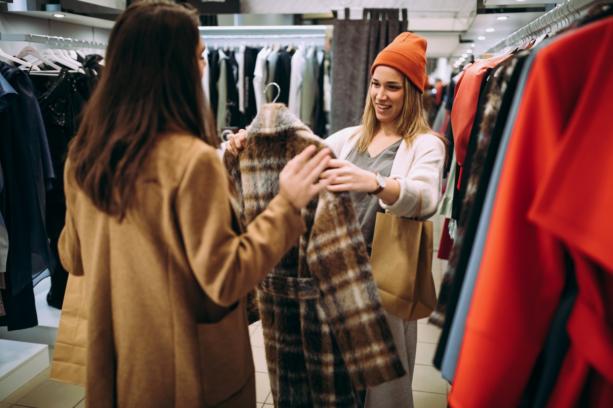 Two people shopping in a store.