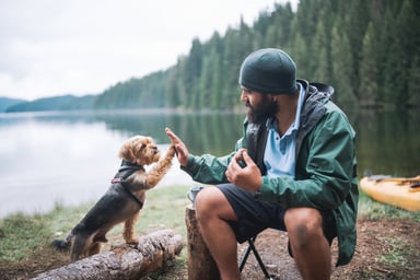 GettyImages-man camping with dog