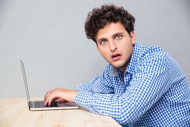 Surprised man on laptop