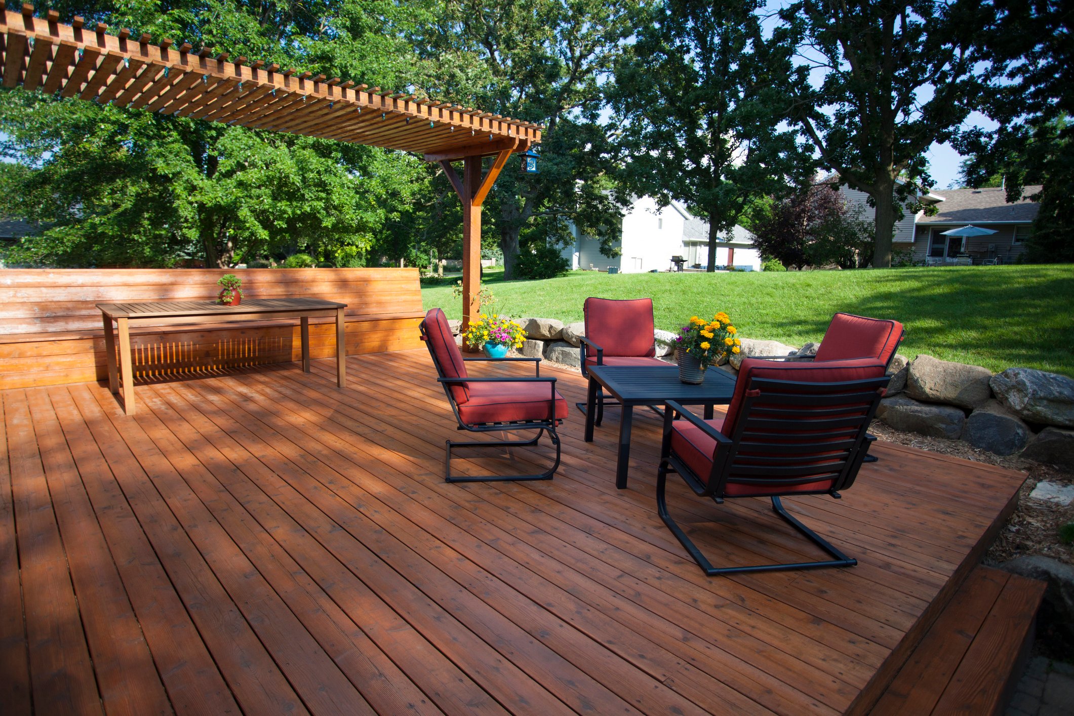 A large deck at the back of a house.