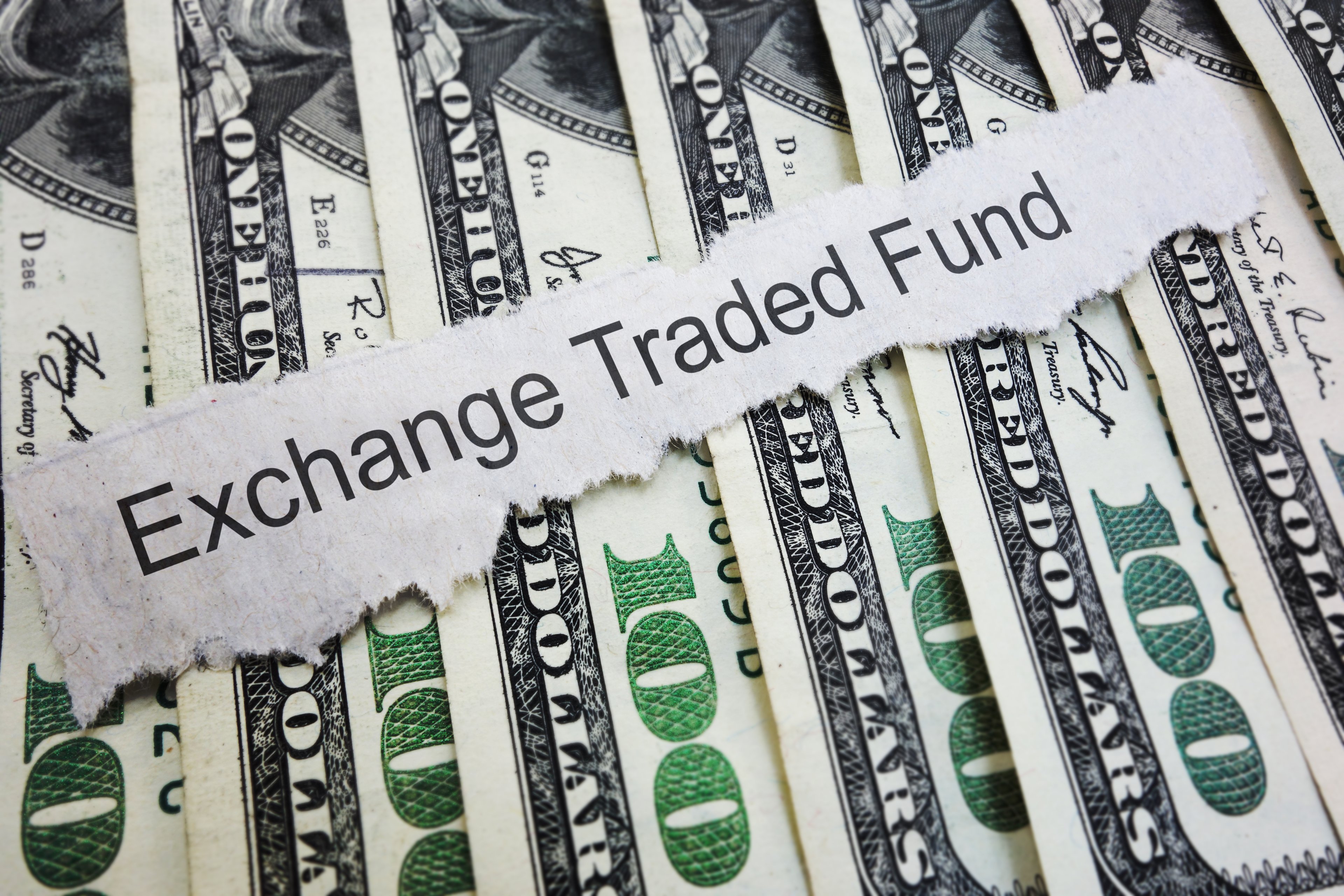Exchange Traded Fund over hundred dollar bills