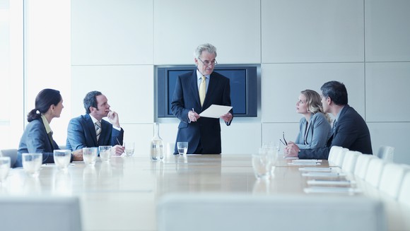 Business people meet in a conference room.