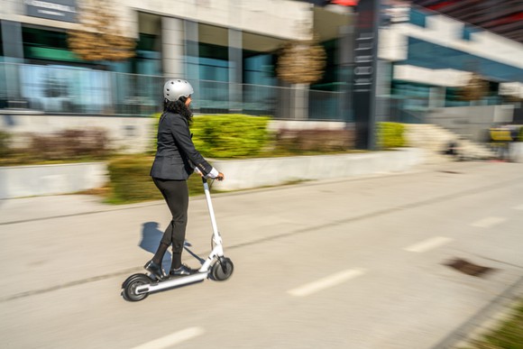 Person riding electric scooter 