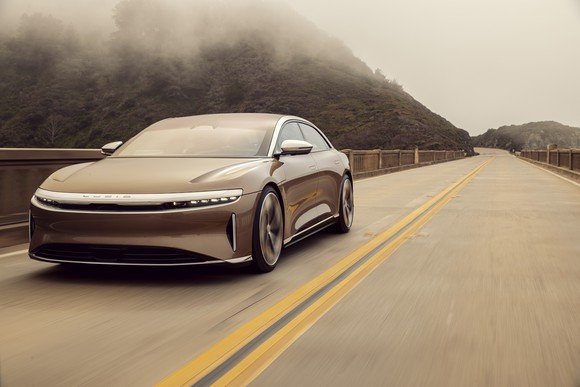 A Lucid Air car on a road.