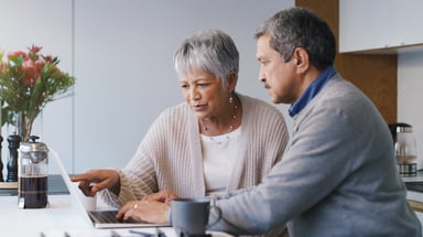 Two people at laptop_GettyImages-1283629468
