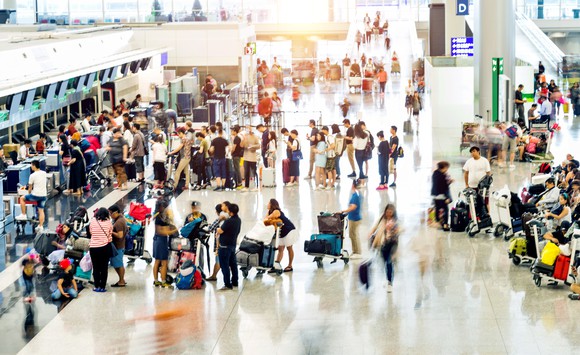 People waiting in line at a terminal.