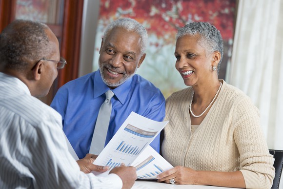 Older people talking with financial advisor.