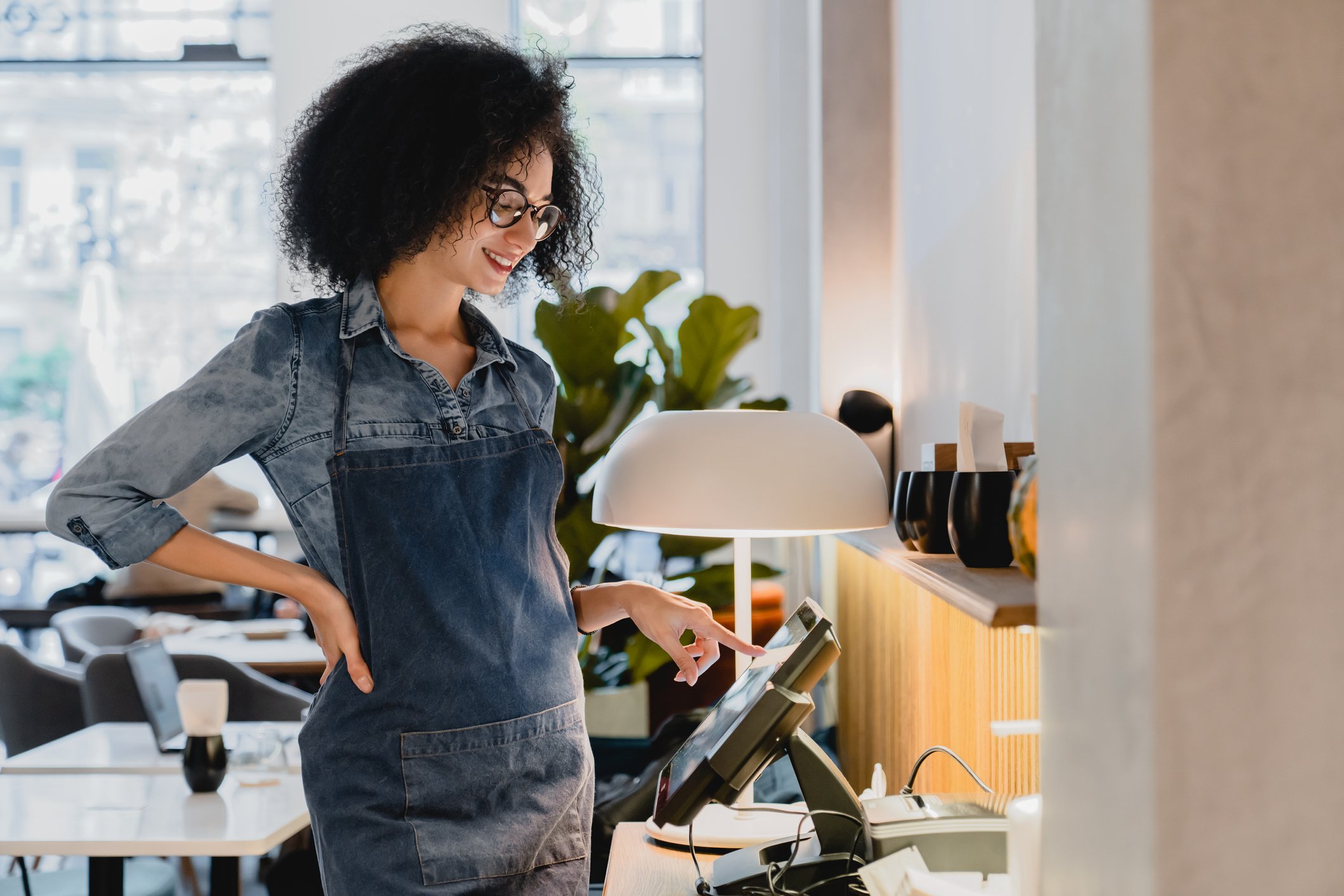 woman interacting with point of sale system