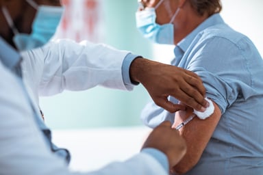 Man receiving a vaccination shot