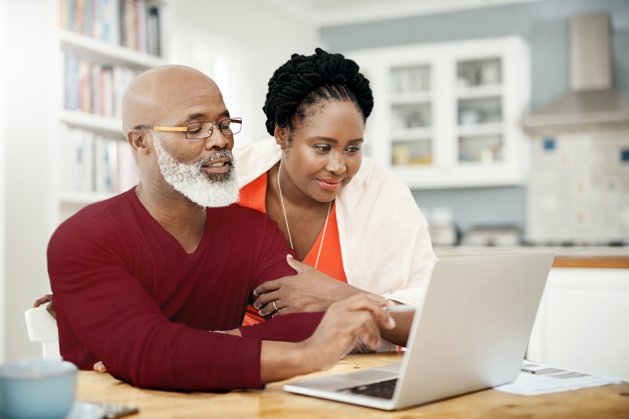 Older couple looking at laptop