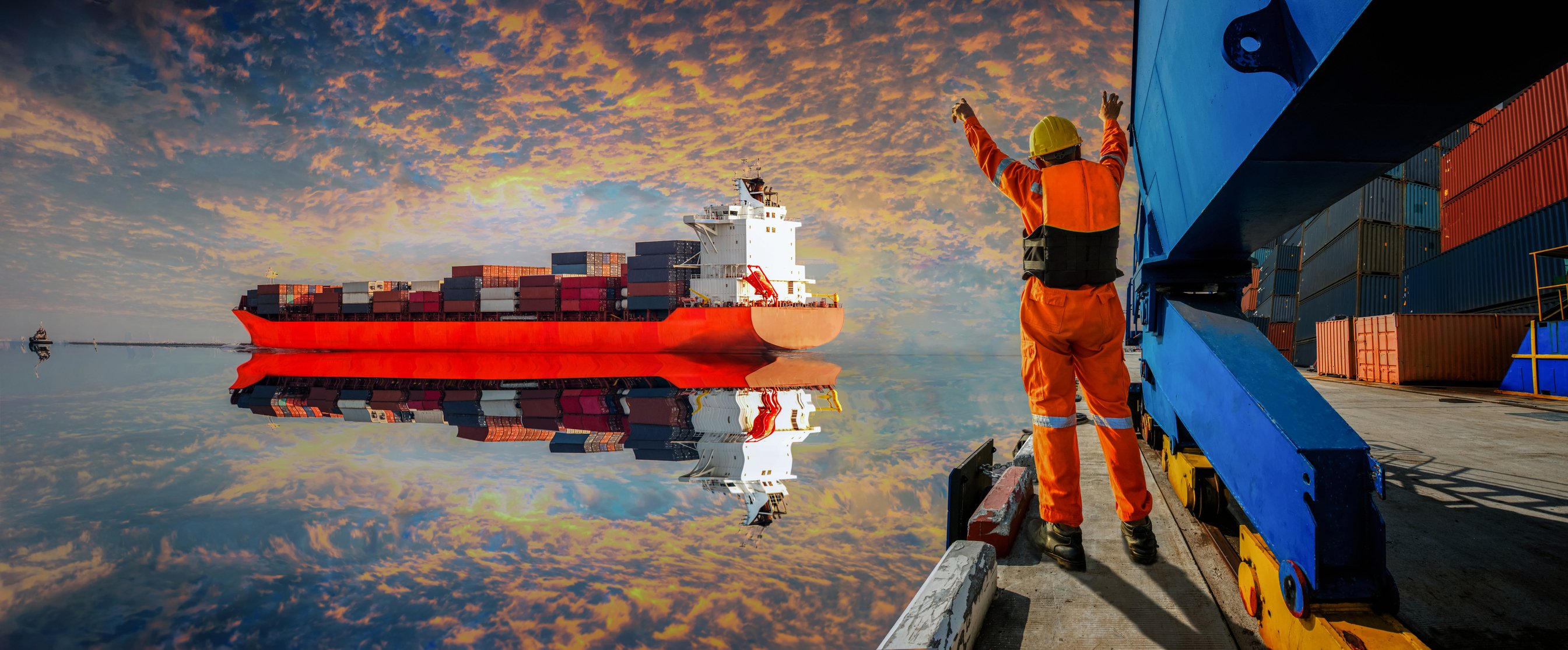 Person waving in a freighter for docking.